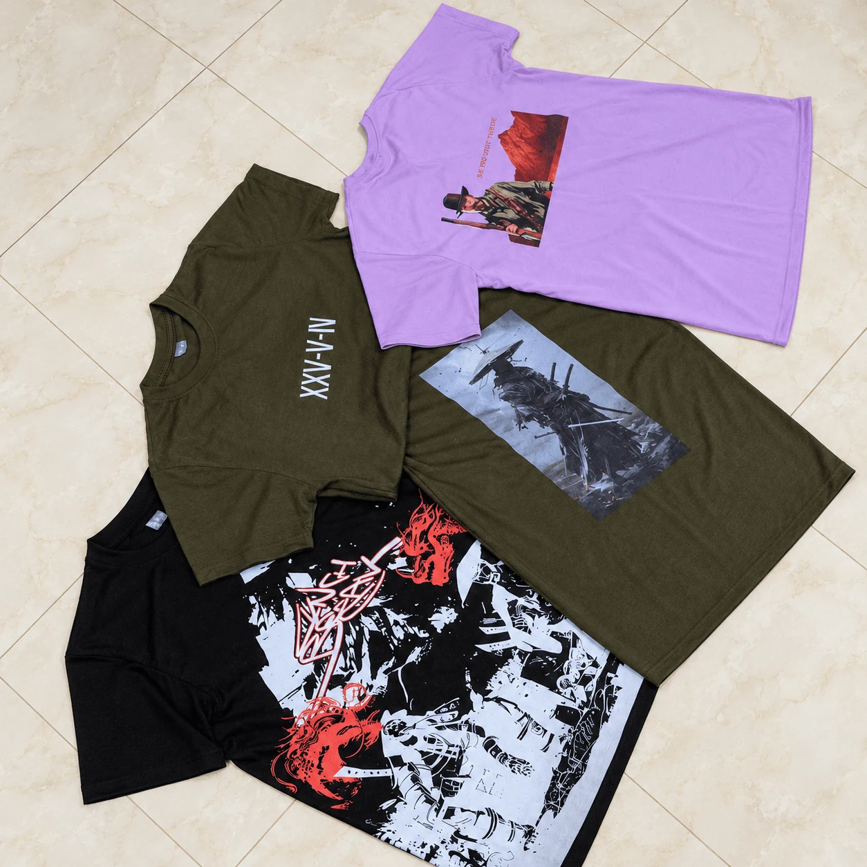 Curated streetwear collection featuring lilac, olive green, and black graphic prints