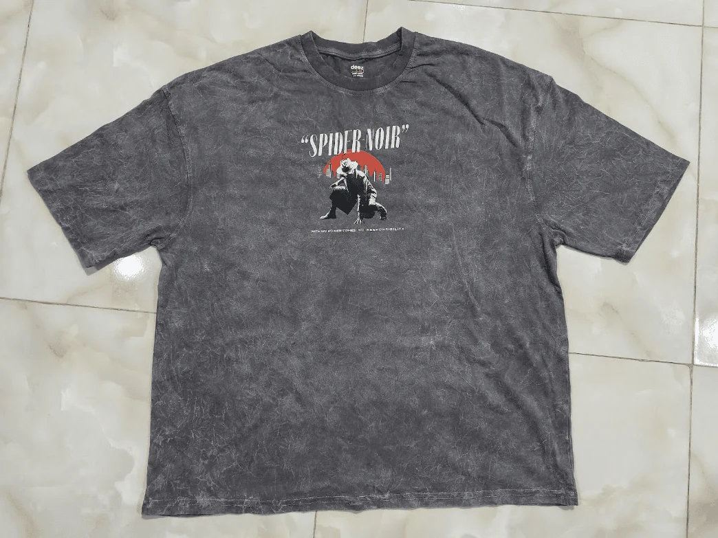 Vintage grey acid wash t-shirt featuring Nicolas Cage Spider Noir crouching illustration