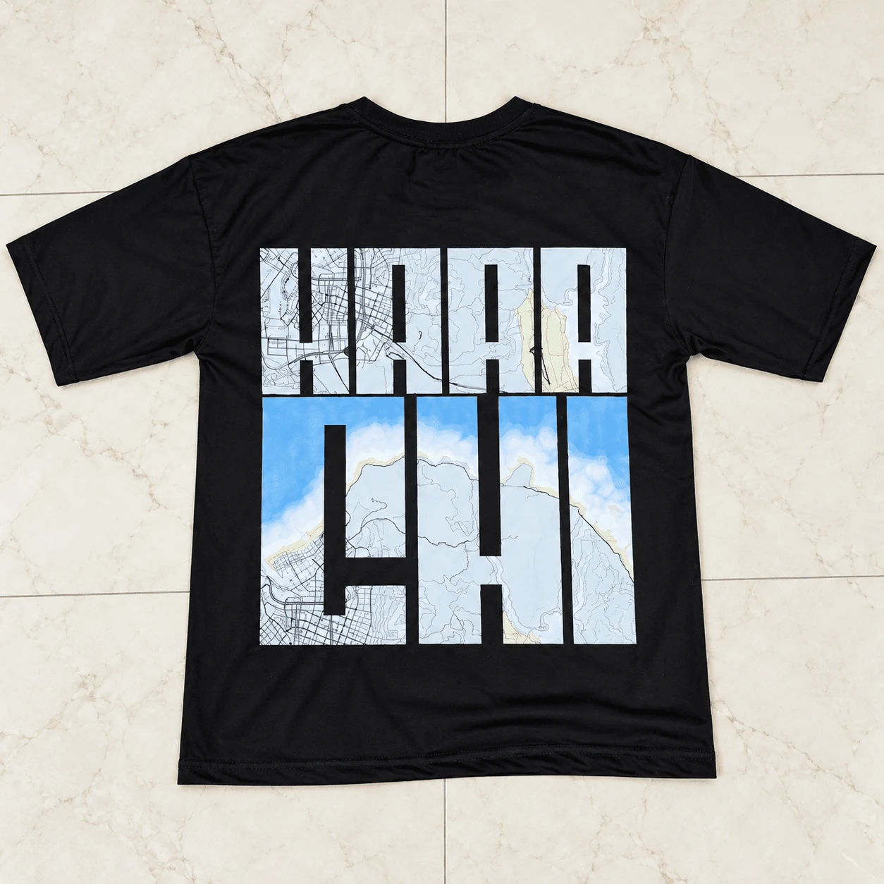 Black drop shoulder tee with bold sky-window KARACHI streetwear typography