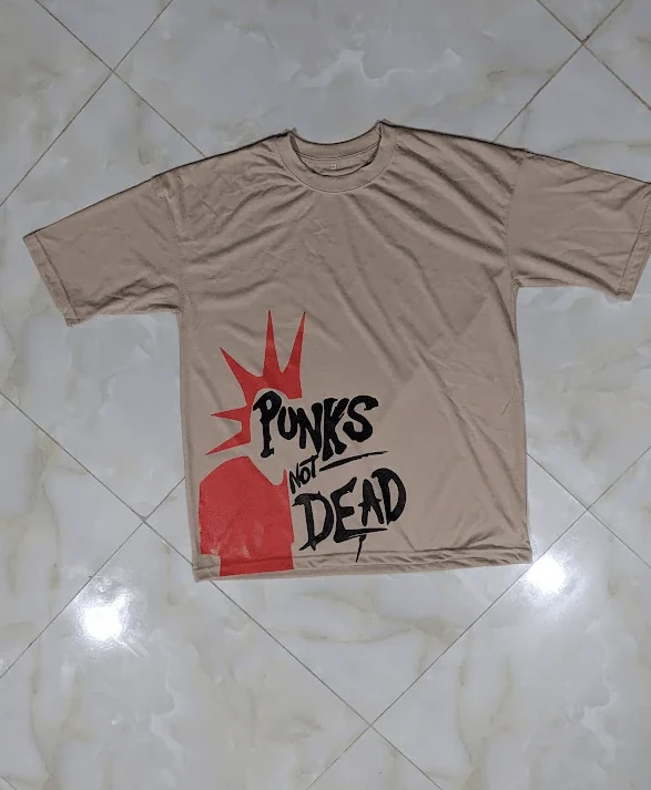 Sand beige oversized tee with vibrant red mohawk Punks Not Dead graphic print