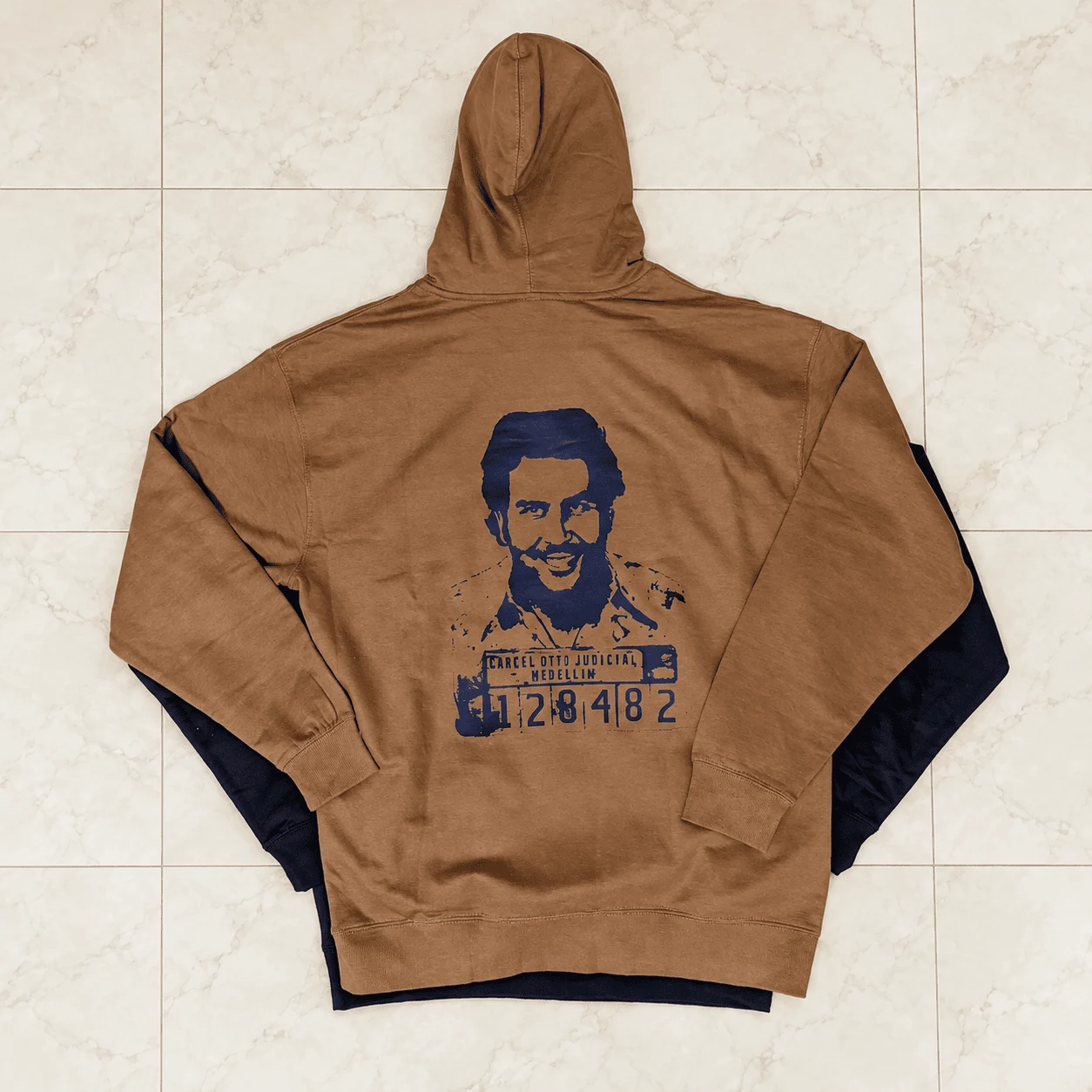 Two-tone camel brown and black hoodie with vintage portrait print